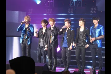 Context: EXO-M performing at KCON on 13 October 2012; historic SM artist and fan-engagement context, not bubble or QQ Music launch imagery.