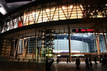 Context: Saitama Super Arena exterior at night on 25 November 2006; the venue named in RIIZE's July 2025 schedule, not a photograph of those shows.